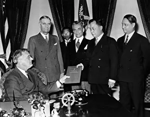 Manuel Prints: President Franklin Roosevelt is presented the Philippine Constitution for his approval by members of the Philippine