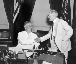 President Franklin Roosevelt shakes hands with Sen. Carter Glass. In 1933 Glass sponsored the Glass-Steagall Act, which separated the activities of banks and securities brokers