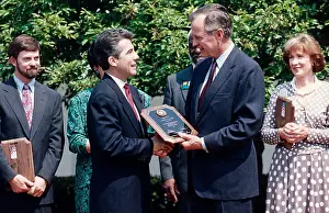 Awards Prints: President George H.W. Bush presents an award to John Walsh, in a 1990 Rose Garden ceremony