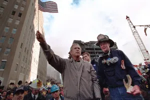 Twin Towers Prints: President George W. Bush waves an American flag after addressing recovery workers in NYC