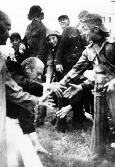 Falling Prints: President Gerald Ford slips on a sloping median strip in front of the Portland