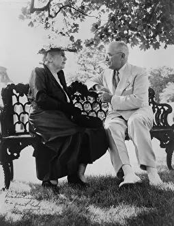 Park Bench Prints: President Harry Truman and Edith Bolling Galt Wilson seated on outdoor bench. June 3, 1952