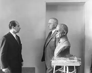 Lcgr1410 Prints: President Harry Truman poses next to the bust by artist Felix de Weldon (left)