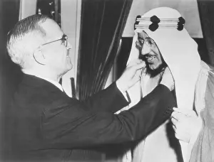 President Harry Truman presents the Legion of Merit to Crown Prince Amir Saud of Saudi Arabia. Feb. 18, 1947
