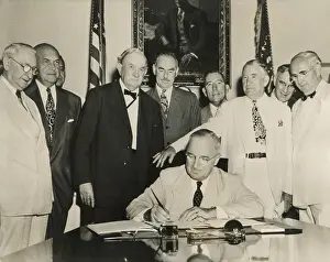 Defense Prints: President Harry Truman signs the Atlantic Pact on July 27