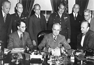9 People Prints: President Harry Truman signs the McMahon/Atomic Energy Act on August 1, 1946