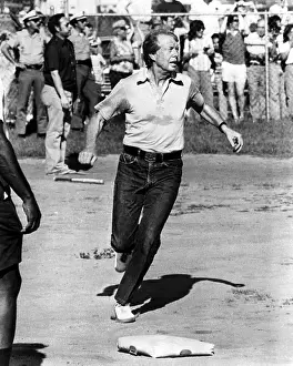 Jimmy Prints: President Jimmy Carter reaches home base in a softball game during a vacation