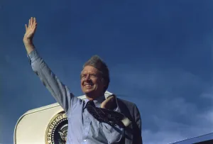 Windblown Prints: President Jimmy Carter waving from Air Force One. Ca. 1977-1980