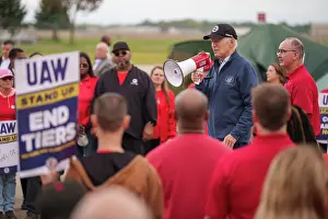 Speaking Prints: President Joe Biden addresses UAW members walking a picket line at the GM Willow Run Distribution Center