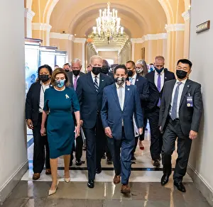 Walking Prints: President Joe Biden is escorted at the US Capitol by Democratic House leadership