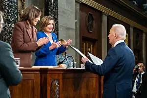 Applauding Prints: President Joe Biden presents copies of his State of the Union address to VP Kamala Harris and House