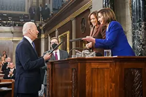 Applauding Prints: President Joe Biden presents copies of his State of the Union address to VP Kamala Harris