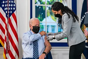 Shot Prints: President Joe Biden receives a COVID-19 booster shot to promote the third inoculation against the corona virus borne
