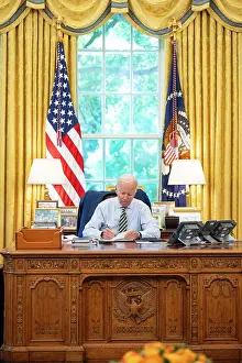 Shoulders Prints: President Joe Biden seated in the White House Oval office at the Resolute desk