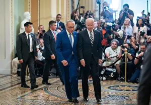 Group Portrait Prints: President Joe Biden and Senate Majority Leader Chuck Schumer depart the US Capitol after speaking with the press