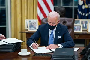Epidemic Prints: President Joe Biden signs one of 17 Executive Orders waiting for him on Inauguration Day