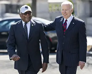 Ukraine Prints: President Joe Biden walks with congressman Jim Clyburn