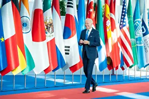 Italian Prints: President Joe Biden walks past the flags of the G20 member nations as he arrives at La Nuvola Convention Center in Rome