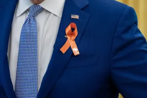 Jacket Prints: President Joe Biden, wears an orange ribbon for gun violence awareness