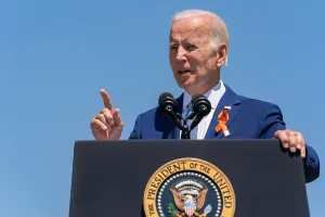 Hand Gesture Prints: President Joe Biden, wears an orange ribbon symbolizing gun violence awareness