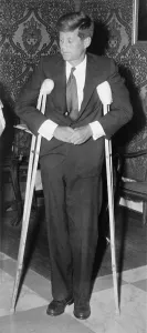 Disability Prints: President John F. Kennedy (1917-1963), standing with crutches on June 12, 1961