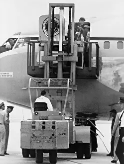 Rs4wn Prints: President John F. Kennedy on crutches disembarking from Air Force One by fork lift