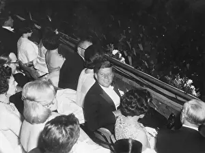 Parents Prints: President John F. Kennedy looks up from his seat in the balcony at the inaugural ball
