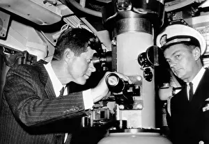 Submarine Prints: President John Kennedy looks through the periscope of the nuclear submarine USS Thomas A