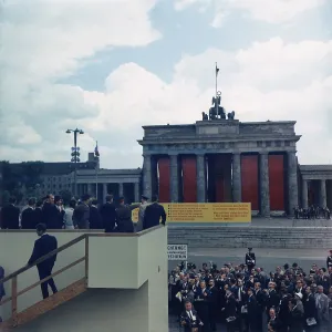 Iron Curtain Prints: President John Kennedy, on a platform overlooking Berlin Wall and Brandenburg Gate in Berlin