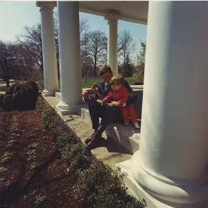 Toys Prints: President John Kennedy plays with son John Jr. at the West Wing of the White House. 1962
