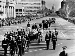 Dallas Prints: President Kennedy's flag-draped coffin moves slowly past mourning crowds