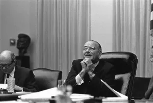 Hand Gestures Prints: President Lyndon Johnson in with a beatific expression during a White House meeting