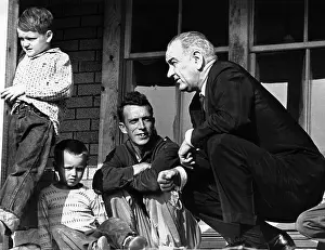 Social Programs Prints: President Lyndon Johnson in conversation the Tom Fletcher family of Inez