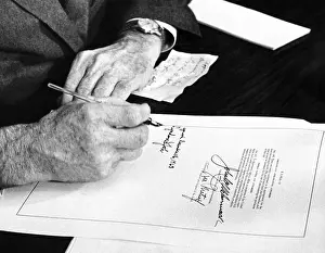 Social Programs Prints: President Lyndon Johnson signs a $102 billion education bill at the White House today