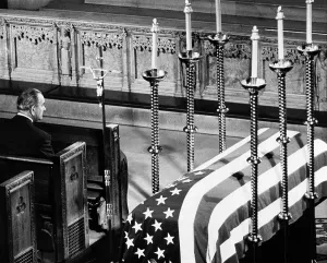 Assassinations Prints: President Lyndon Johnson sits next to Senator Robert Kennedy's flag-draped coffin during Solemn Requiem Mass at St