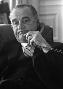 Desks Prints: President Lyndon Johnson on the telephone in the Oval Office, White House. Jan. 10, 1964