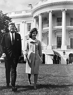 Three Quarter Sleeves Prints: President and Mrs. John F. Kennedy walking on the south lawn of the White House on April 16