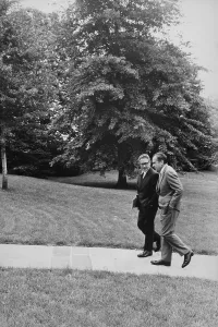 Kissinger Prints: President Nixon walking with Kissinger on south lawn of the White House. Aug. 10 1971
