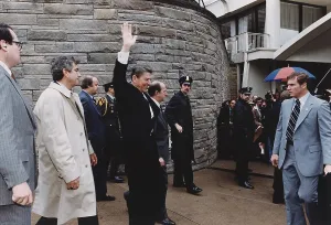 Shot Prints: President Reagan waving to crowds immediately before being shot in an assassination attempt