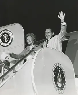 Nighttime Prints: President Richard Nixon and the First Lady Patricia Nixons wave from the door of Airforce One on August 11