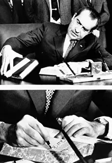 President Richard Nixon signing the budget for fiscal 1972 which he is sending to Congress