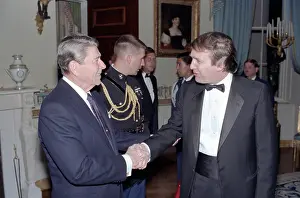 6 People Prints: President Ronald Reagan Shaking Hands with Donald Trump at a White House reception for members of Friends of Art