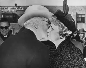 Couples Portraits Prints: President Truman kisses his wife goodbye before boarding the plane for Washington. Mrs