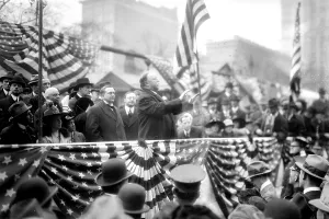 1900 1910 Prints: President William Taft (1857-1930) speaking on a flag draped podium in 1909