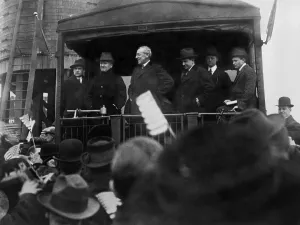 Speeches Prints: President Woodrow Wilson speaking to a crowd from the back of a train