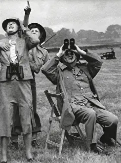 Lcgr1501 Prints: Prime Minister and Mrs. Churchill watching a fighter intercept a German buzz bomb overhead
