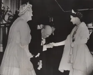 Prime Minister Winston Churchill and Lady Churchill bows to Queen Elizabeth as she arrives at his retirement dinner in London, April 4, 1955