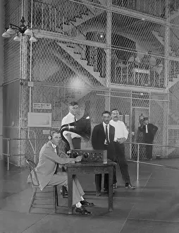 Guards Prints: Prisoners in a Washington D.C. vicinity jail listen to a radio broadcast in 1922