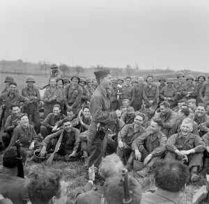 Movie Stars Prints: Private Mickey Rooney entertains infantry men of the 44th Division in Kist