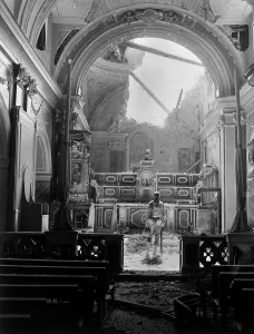 Lcgr1401 Prints: Private Paul Oglesby, stands before the altar of a damaged Catholic Church during World War 2